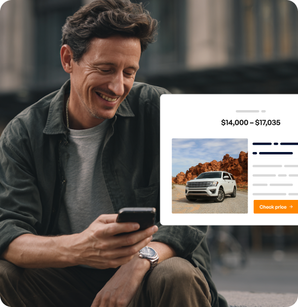 Man smiling while looking at his phone using the Onit platform.