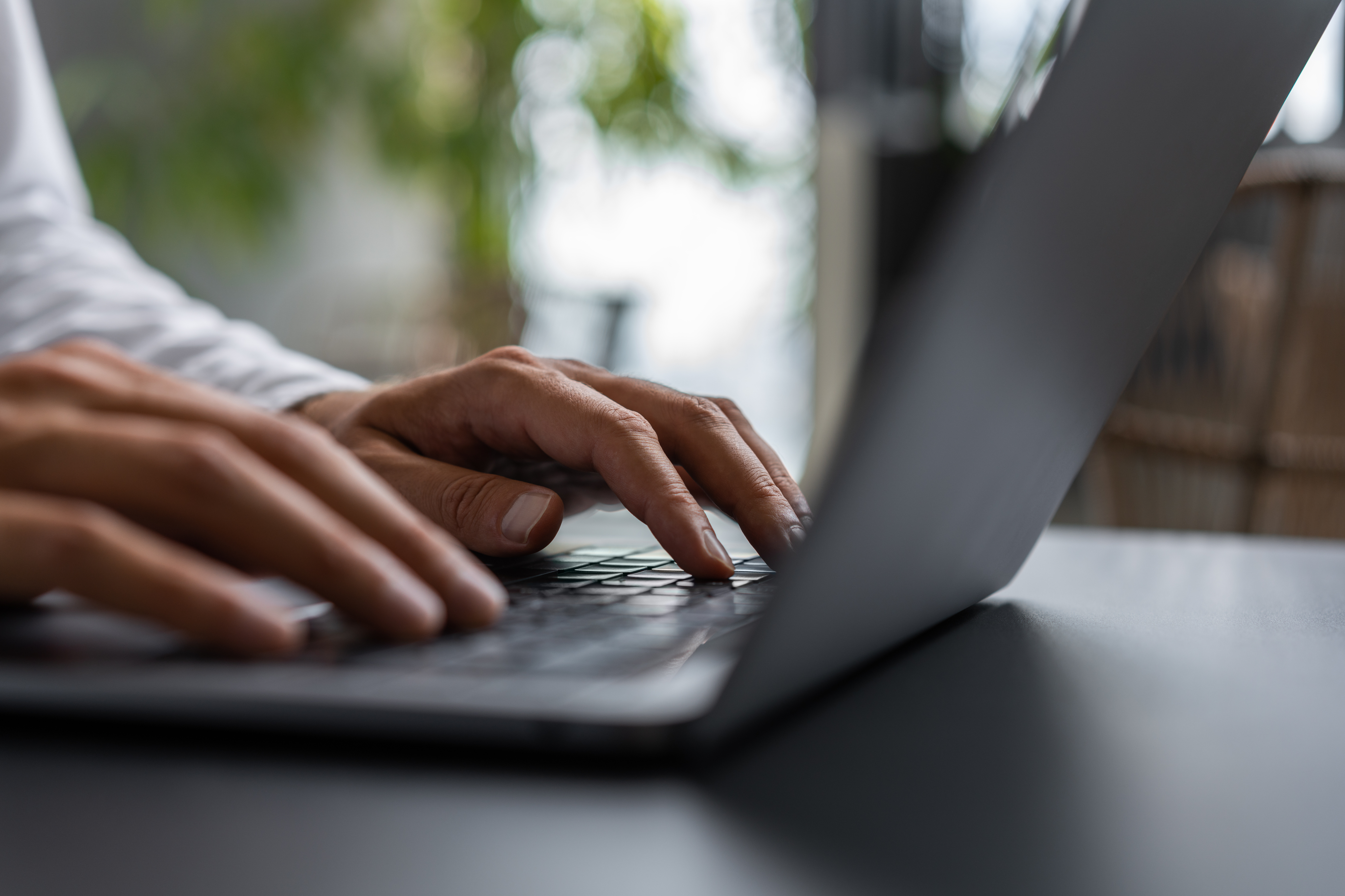 Stock photo of someone typing on laptop computer.